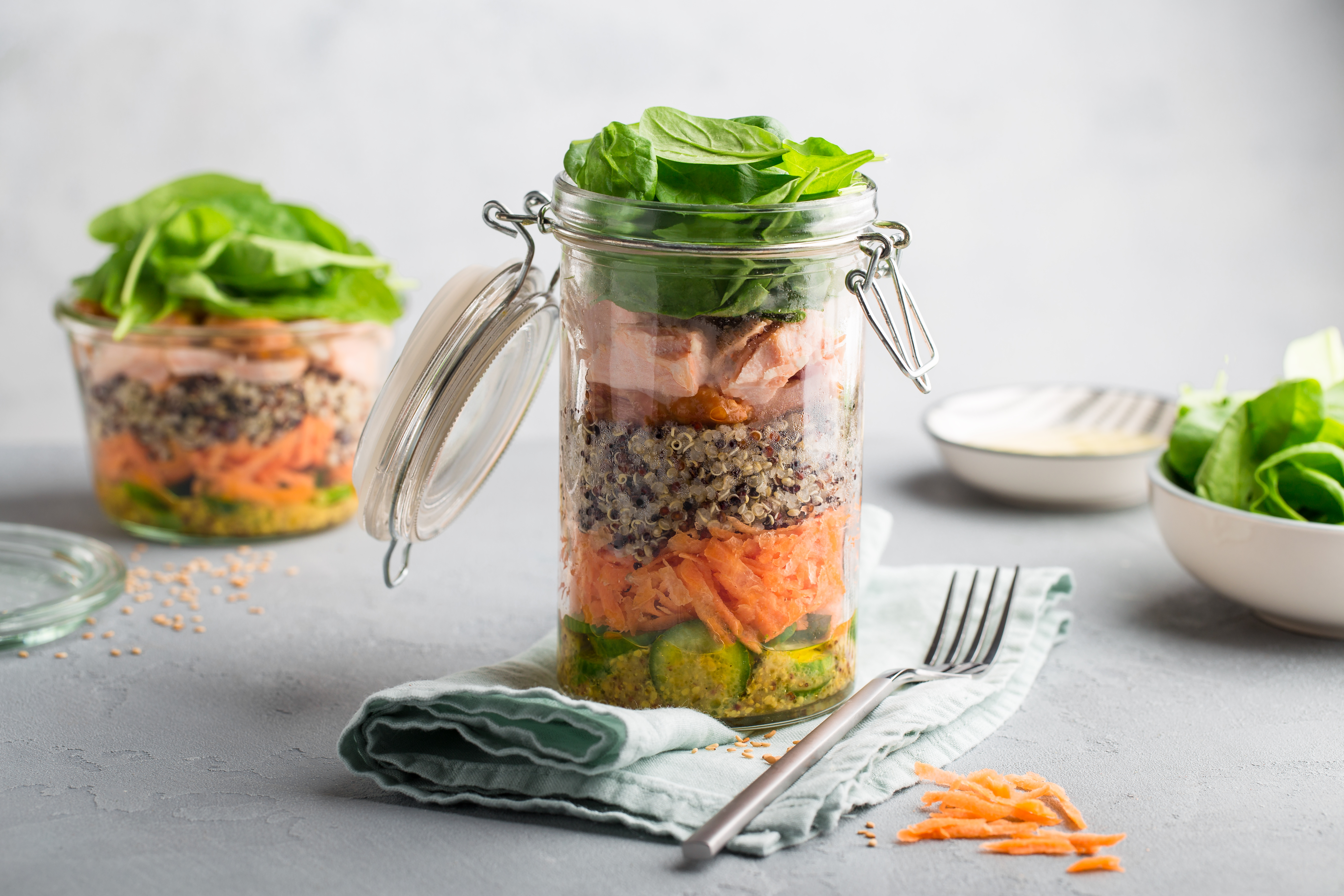 Salmon, quinoa and fresh veggies in a jar