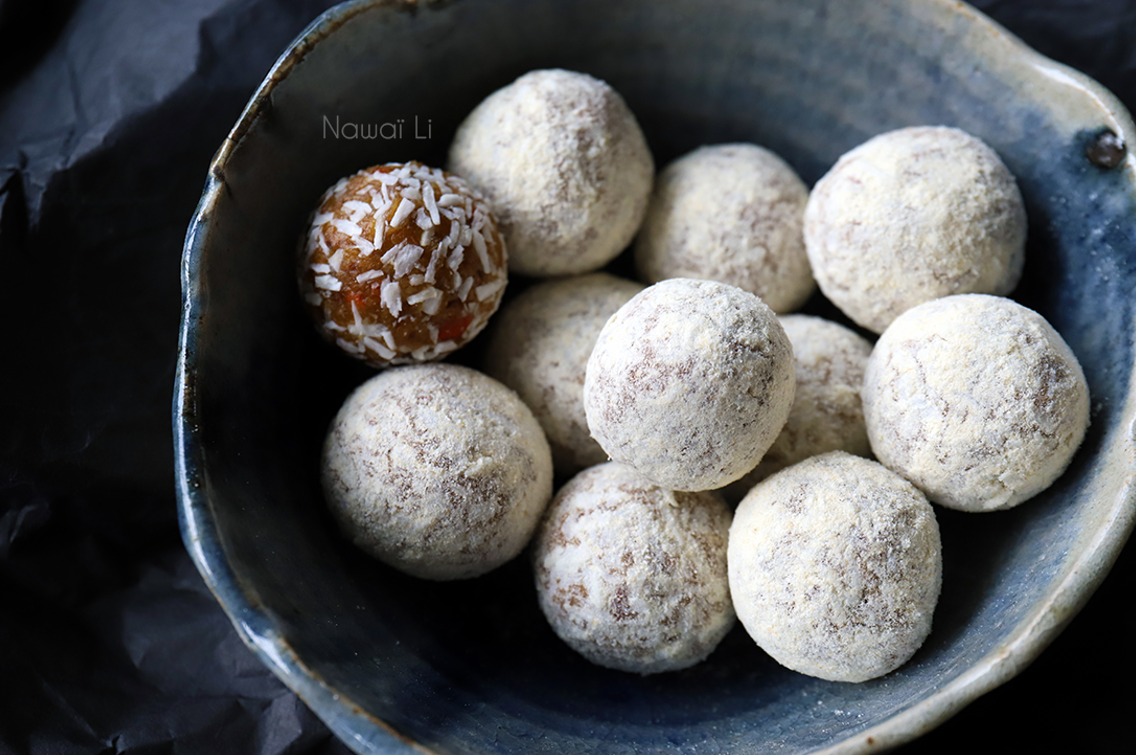 Energy balls in a bowl, coated in coconut shreds