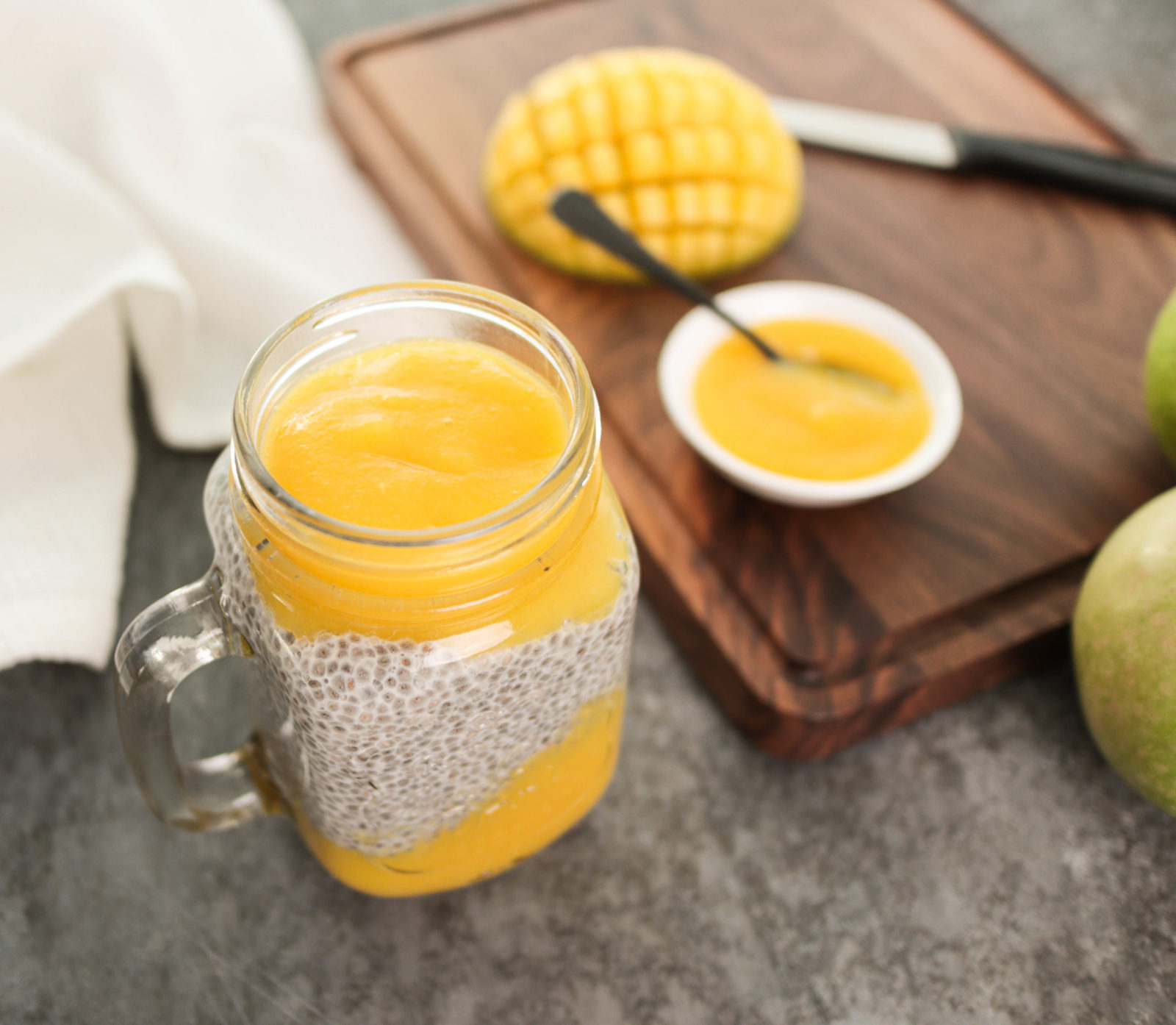 Chia pudding with mango puree in a mason jar