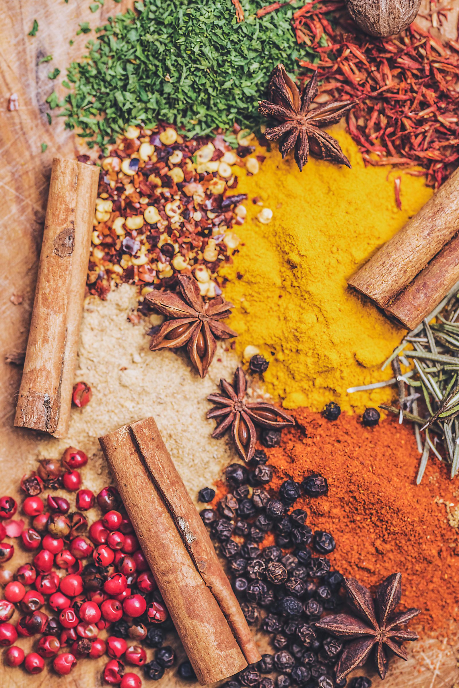Colourful spices like cinnamon, cloves, pepper and turmeric