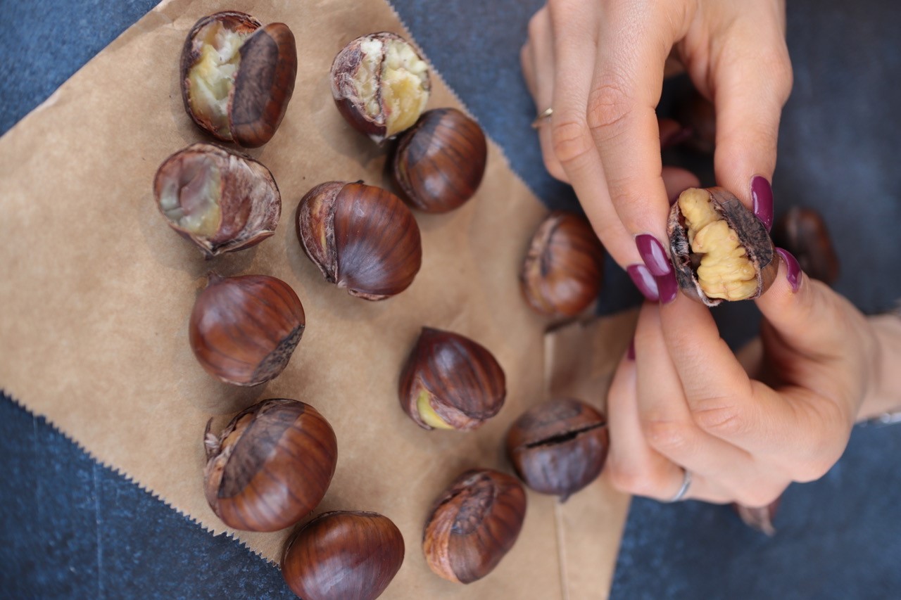 Chestnuts being peeled by hand