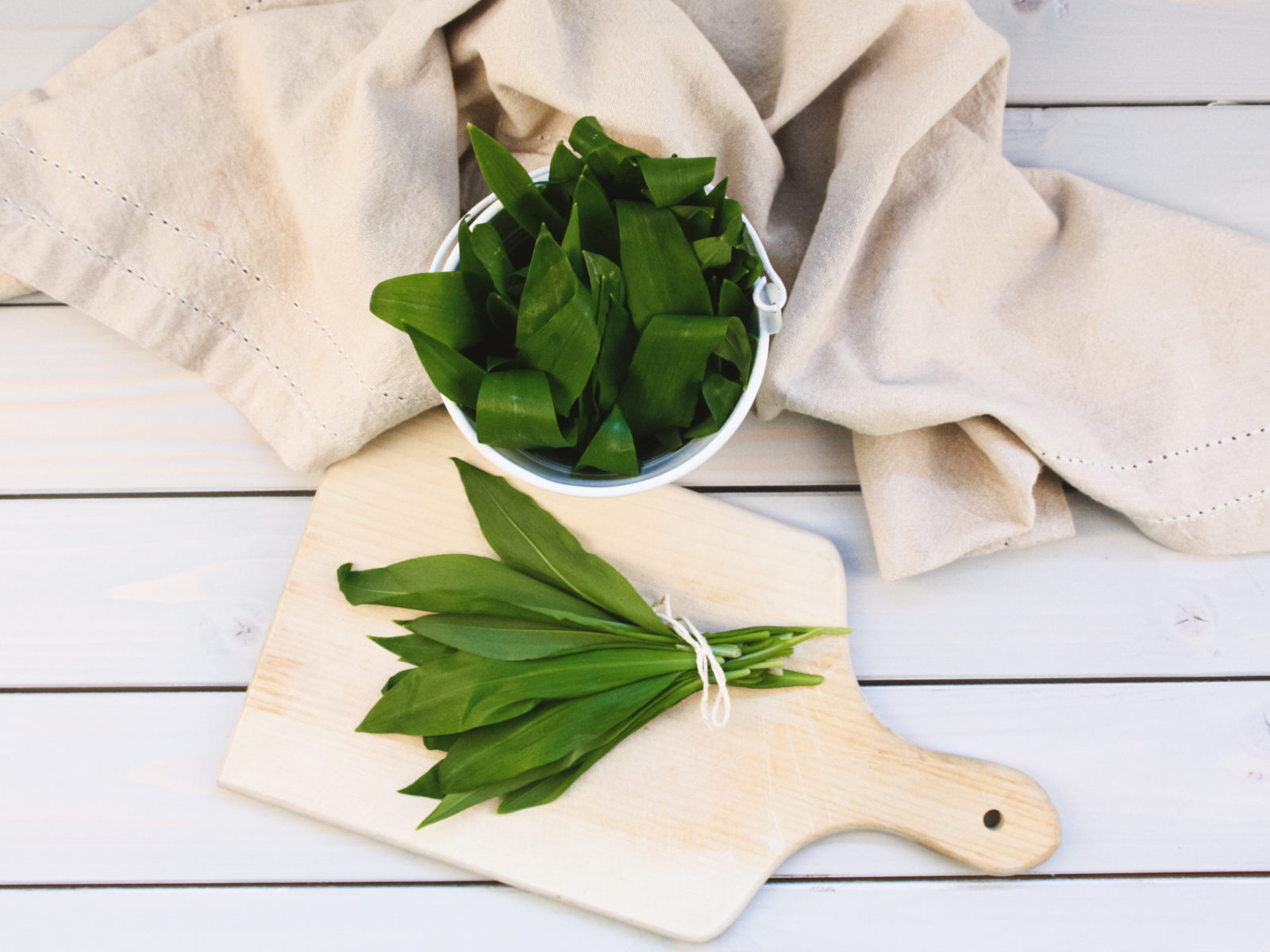 wild garlic on wooden board