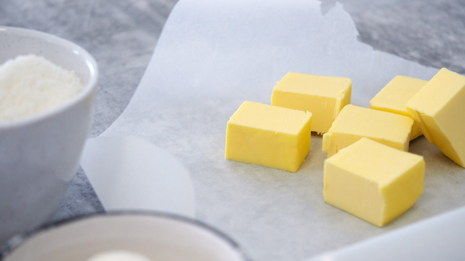 Butter cubes on a baking sheet