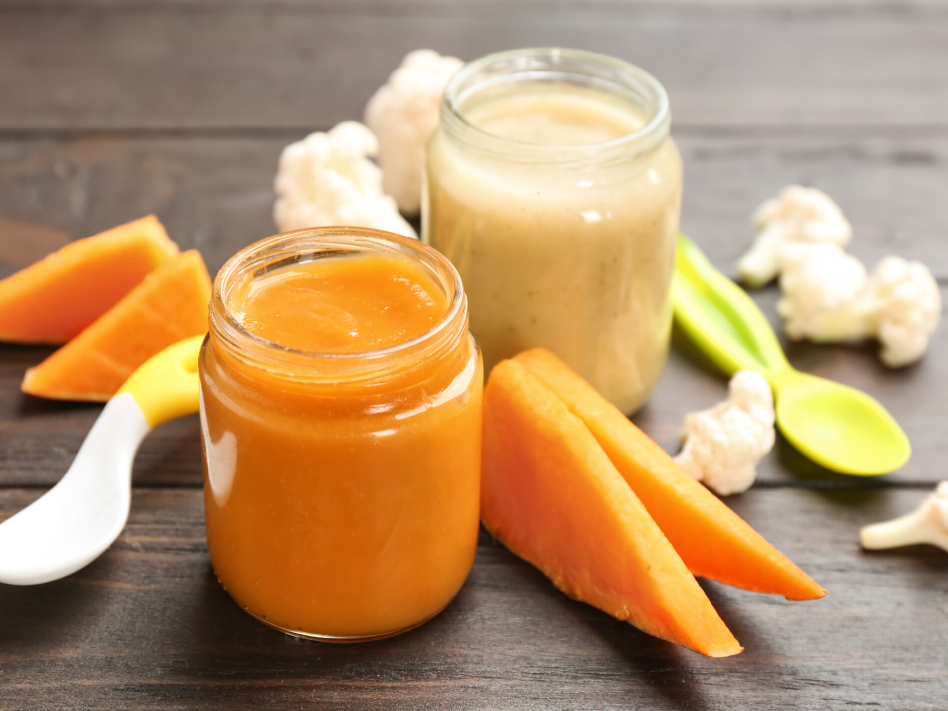 Orange and yellow baby food in jars