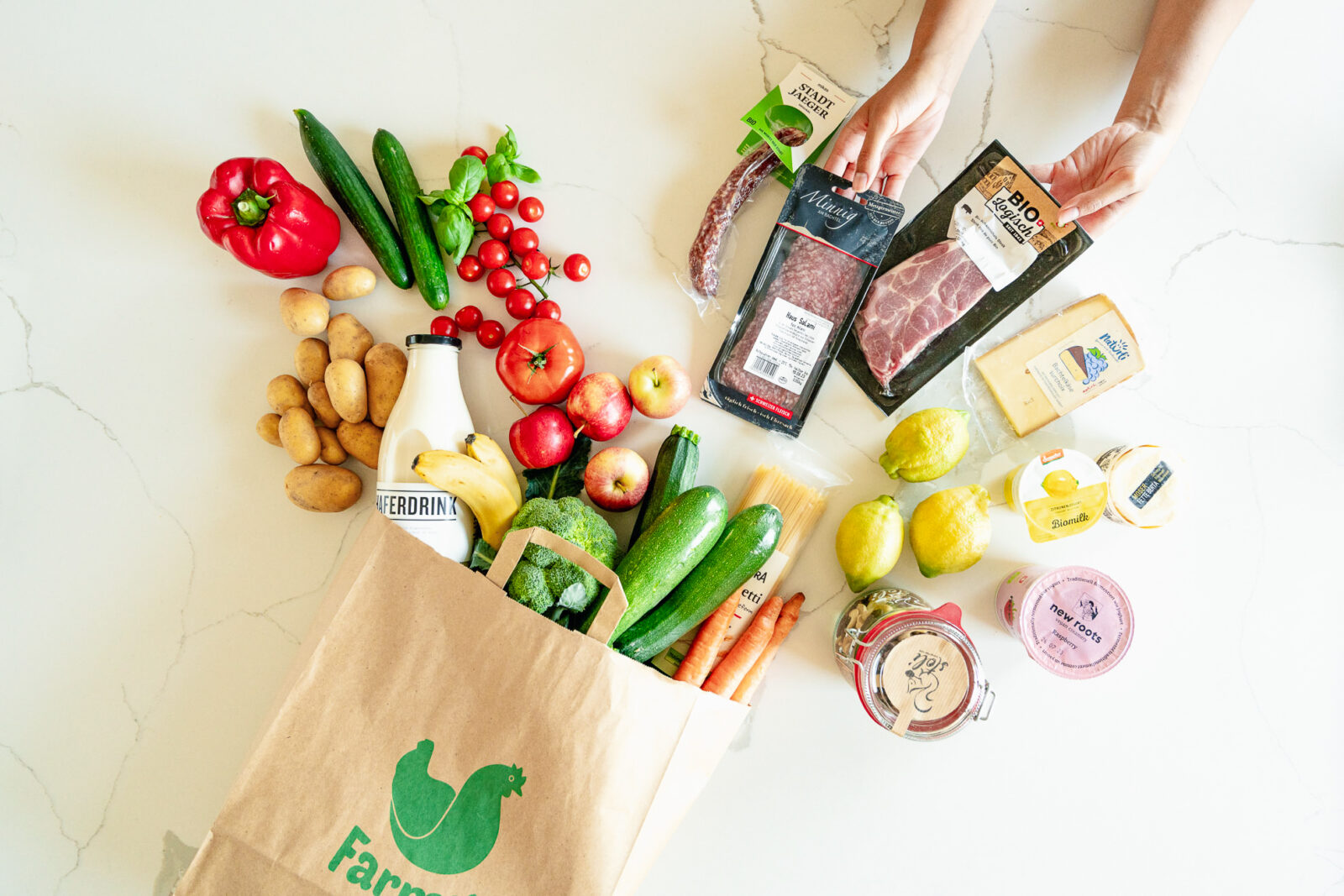 Meat and fresh food on a white marble background