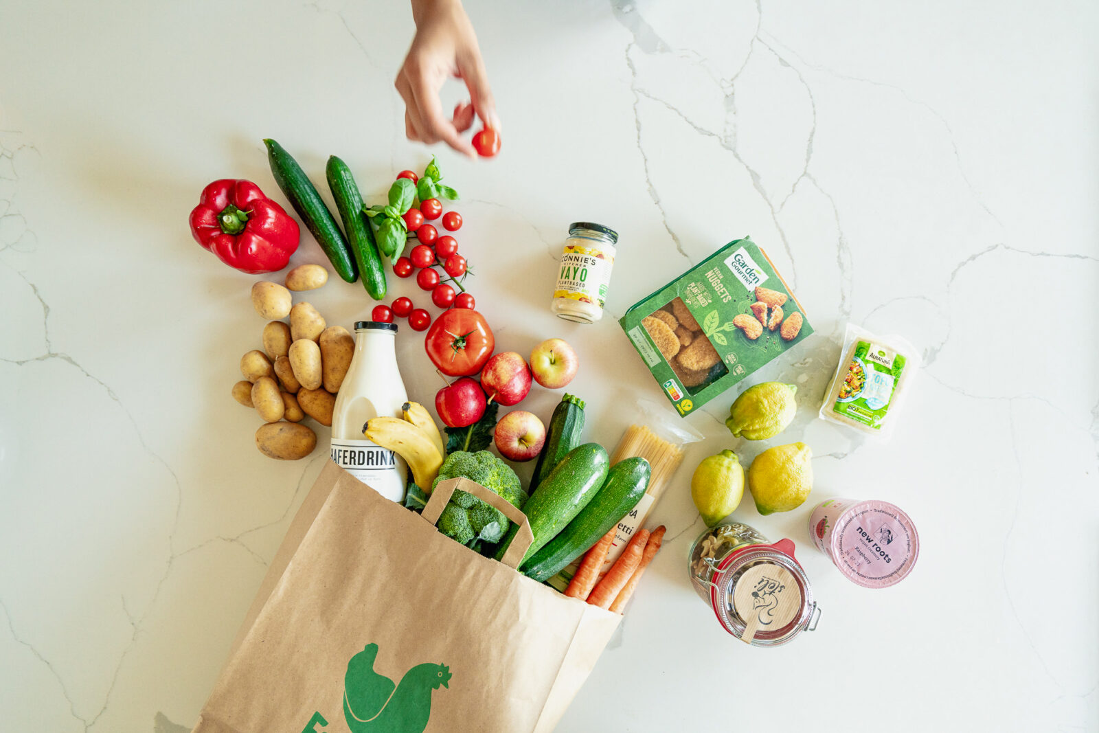 Fresh food and vegan convenient food on a white marble table