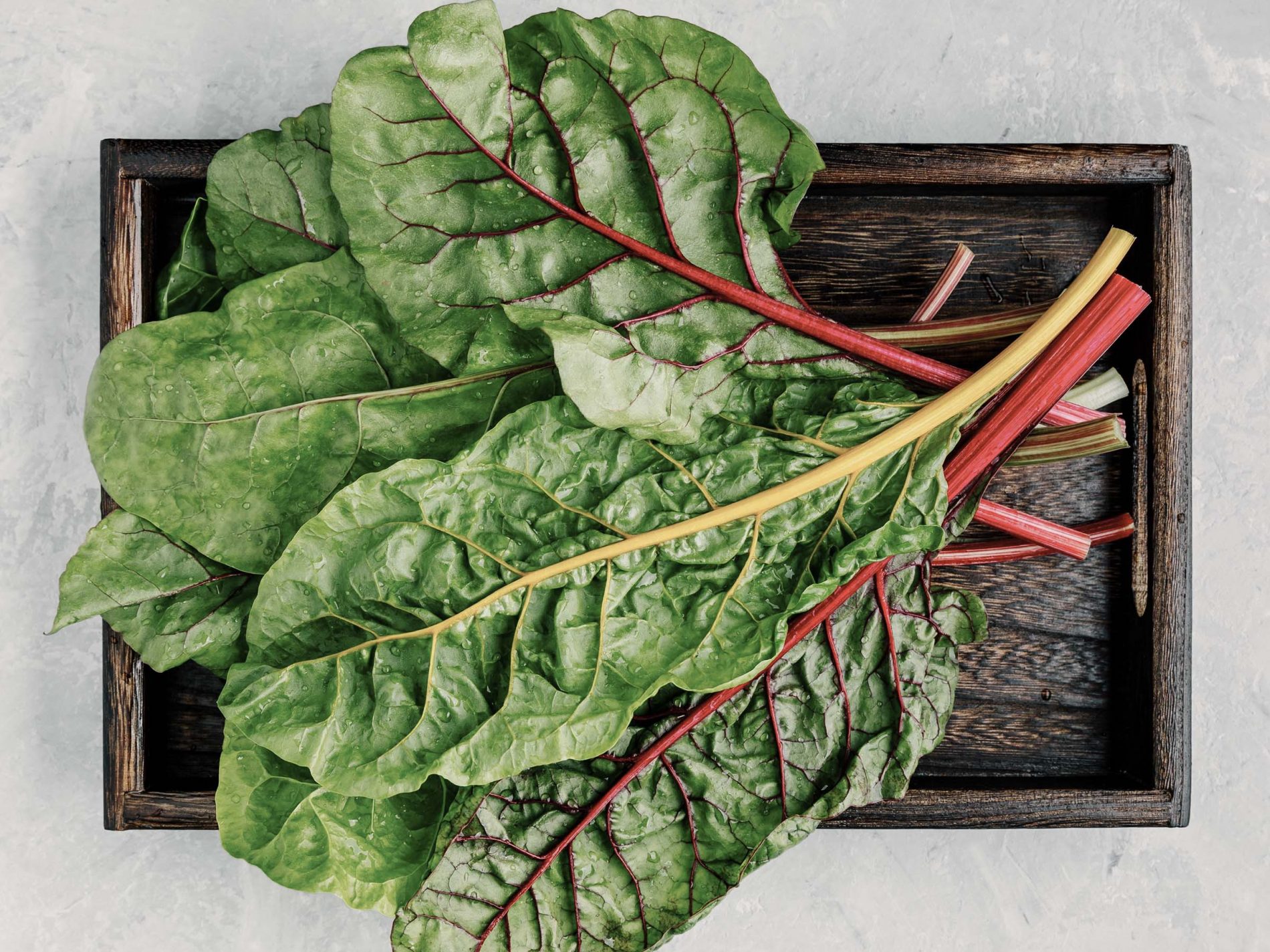 Swiss chard on a wooden tray